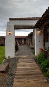 a walkway leading to a building with a doorway at Hotel Boutique Rincon Sagrado in Atlixco