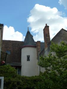 a building with a chimney on top of it at Le Jardin Andrinople in Richelieu