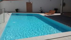 Bazén v ubytování Hotel Porto do Sol nebo v jeho okolí