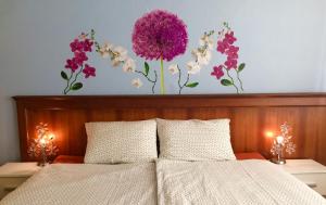 Postel nebo postele na pokoji v ubytování Blue Rose Apartman