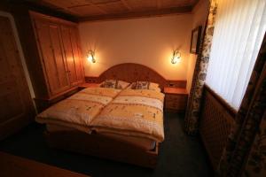 En eller flere senge i et værelse på B&B Ciasa Weber