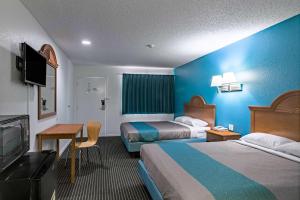 TV a/nebo společenská místnost v ubytování Motel 6-Azle, TX