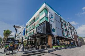 a large building with a lot of windows at The Bloc Hotel - SHA Extra Plus in Patong Beach