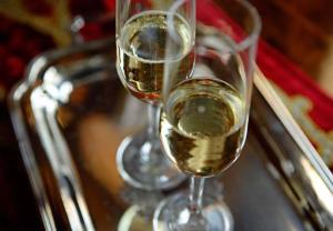two glasses of white wine sitting on a table at Best Windows in Venice