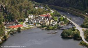 an aerial view of a town next to a river at Rongahuset BnB in Evanger
