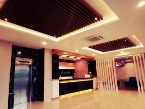 a room with a lobby with a bar in it at Venia Hotel Batam - CHSE Certified in Sagulung