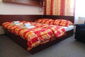 Кровать или кровати в номере Hotel Rambousek