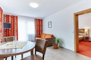 Telewizja i/lub zestaw kina domowego w obiekcie Apartment Bergsee