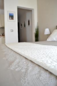 a close up of a white mattress on a bed at Domus Duomo in Florence