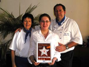 a man and woman holding a star award at Gasthof Goldener Stern in Aalen