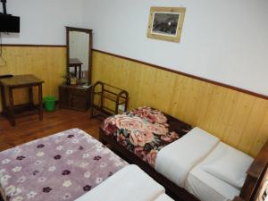 Postel nebo postele na pokoji v ubytování Sapu's Mountain breeze Nuwara Eliya