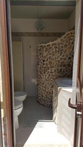 a bathroom with a toilet and a sink at Villa Alba in Valderice +25 photos