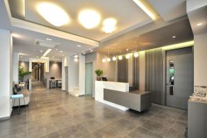an office with a lobby with a reception desk at Astron Suites & Apartments in Kos