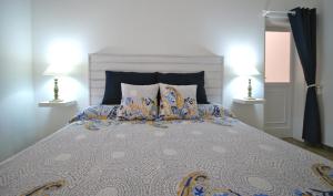 Llit o llits en una habitació de El Aceitun Beach Holiday Homes
