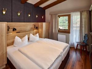 A bed or beds in a room at A Casa Juwel Apartment
