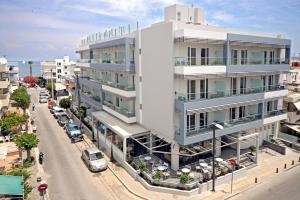 an architectural rendering of a white building on a street at Astron Suites & Apartments in Kos