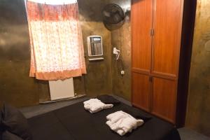 Rúm í herbergi á ALCATRAZ JAIL-HOSTEL