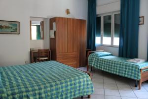 Postel nebo postele na pokoji v ubytování Hotel Edera