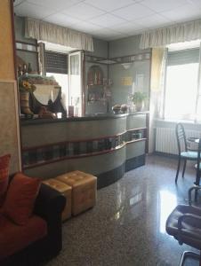 a living room with a couch and a counter at Albergo Di Piero in Caramanico Terme