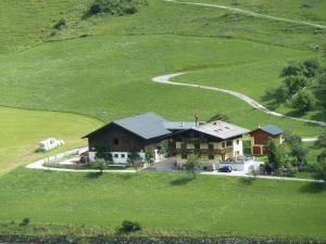 an aerial view of a house in a field at Rainerhof in Dorfgastein