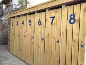 a wooden fence with numbers on it at Southover Beach in Woolacombe