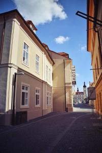 an empty street in a town with buildings at Hotel U Hradu in Mladá Boleslav