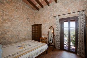 Кровать или кровати в номере Agroturismo Sa Duaia