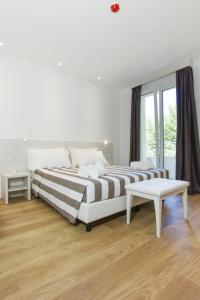 Postel nebo postele na pokoji v ubytování Hotel Houston Suites