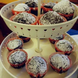 a plate of red velvet cupcakes with powdered sugar at Residence Villaggio Verde in Sorrento