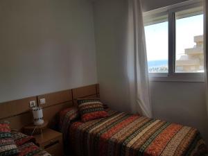 Postel nebo postele na pokoji v ubytování Cala Blanca 2 Frontal al Mar