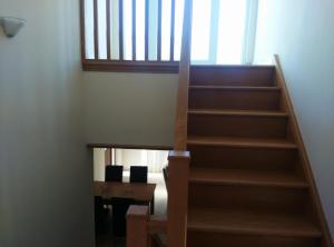 a staircase leading up to a room with a table at Pomos Harbourbiew Villa in Pomos