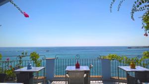 a view of the ocean from a balcony at Hotel Palladio in Giardini Naxos