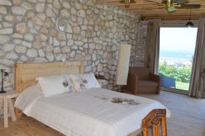 Posteľ alebo postele v izbe v ubytovaní Villas Panorama Apolpaina Lefkas