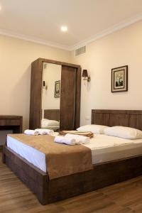 Postel nebo postele na pokoji v ubytování Hotel Kolkhi Shekvetili