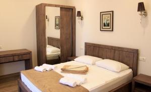 Postel nebo postele na pokoji v ubytování Hotel Kolkhi Shekvetili