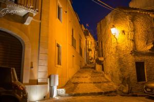 an alley in an old town at night at Casa Sofia Vacanze A Montalbano Elicona in Montalbano Elicona