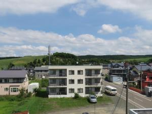 a view of a city with a building at Frontier Sunrise in Kami-furano