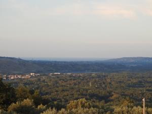 a view from the top of a hill with trees at Soggiorno Ulivi in Altino