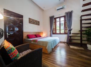 Postel nebo postele na pokoji v ubytování Hanoi Balcony Homestay
