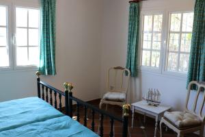 Postel nebo postele na pokoji v ubytování Casa los Almendros