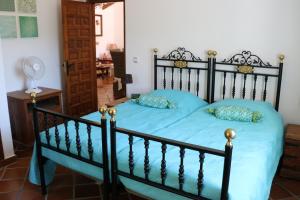 Postel nebo postele na pokoji v ubytování Casa los Almendros
