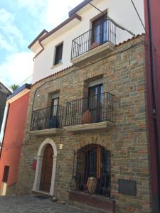 a building with two balconies on top of it at Le Stanze di Mamma Pia in Casal Velino