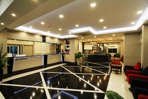 a lobby of a hotel with a glass floor at The Contrast i Hotel in Pluak Daeng