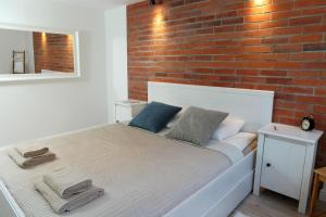Łóżko lub łóżka w pokoju w obiekcie Sea Apartment 150m do morza