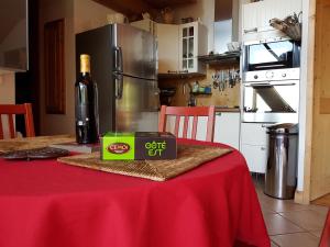 a bottle of wine on a table in a kitchen at Arpege Des Neiges in Sainte-Foy-Tarentaise