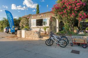 a couple of bikes parked in front of a house at Holiday Park Mandrice in Mandre
