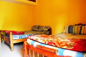 Postel nebo postele na pokoji v ubytování Akashadeepa Homestay