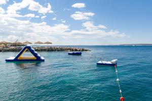 a group of inflatable boats in the water at Holiday Park Mandrice in Mandre