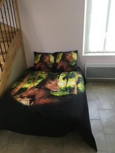 Postel nebo postele na pokoji v ubytování Gîtes De Saint Rémy