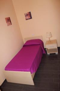 A bed or beds in a room at Un Posto Al Sole